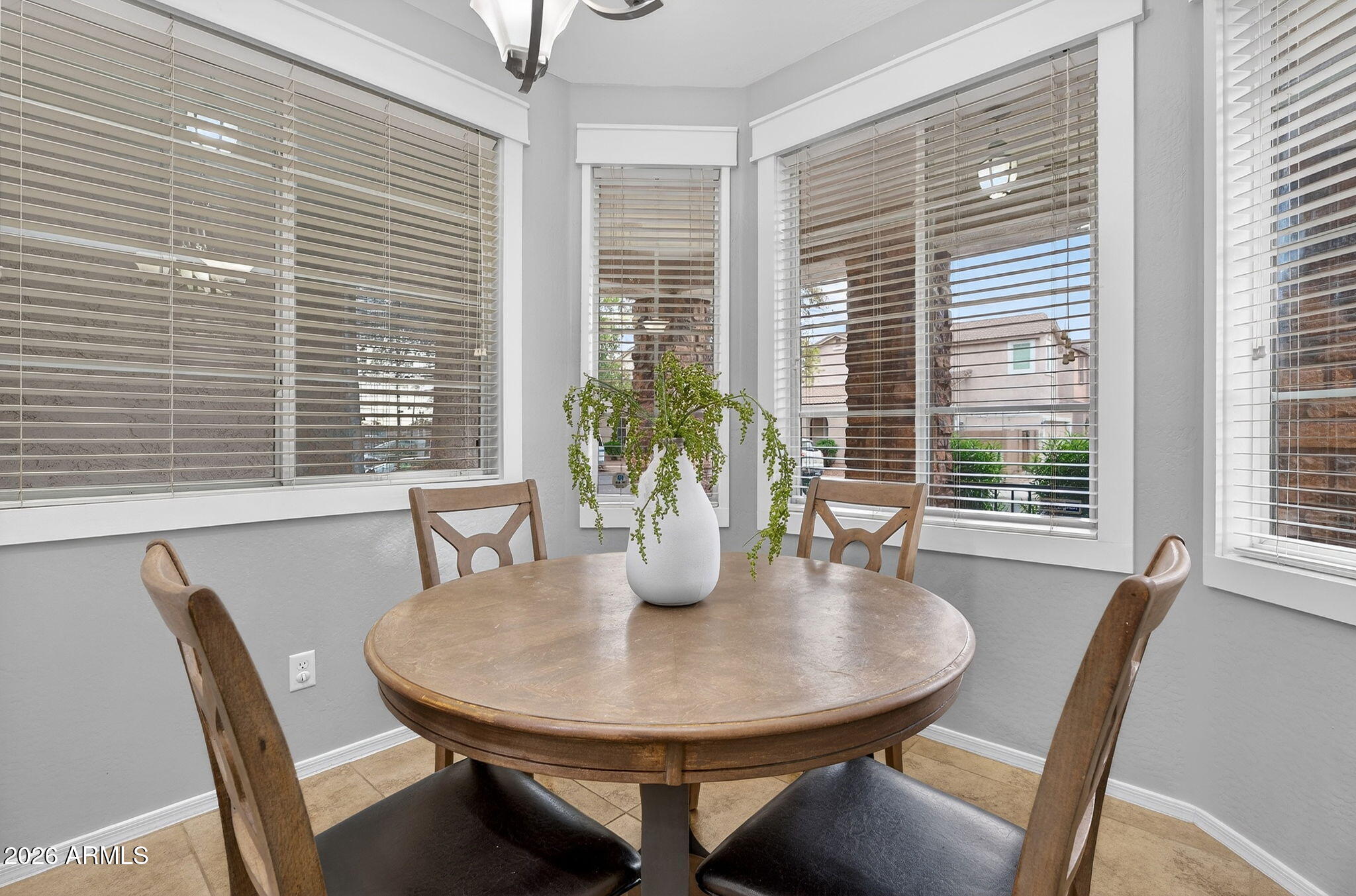 4052 East Milky Way Gilbert, AZ 85295 - Photo 15 of 73 a dining room with furniture and window