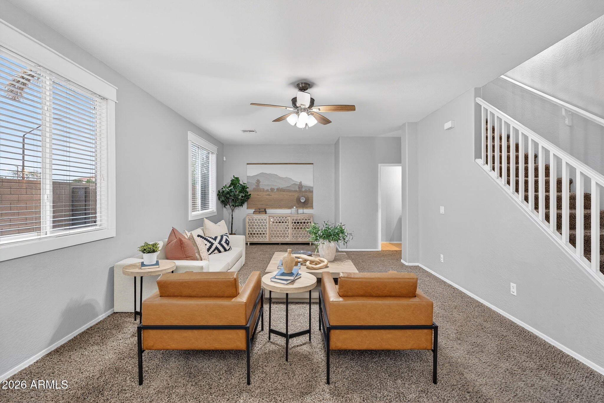 4052 East Milky Way Gilbert, AZ 85295 - Photo 18 of 73 a living room with furniture and a chandelier
