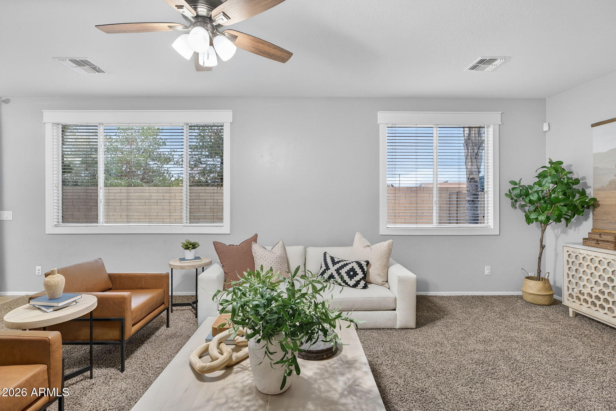 4052 East Milky Way Gilbert, AZ 85295 - Photo 19 of 73 a living room with furniture and a potted plant