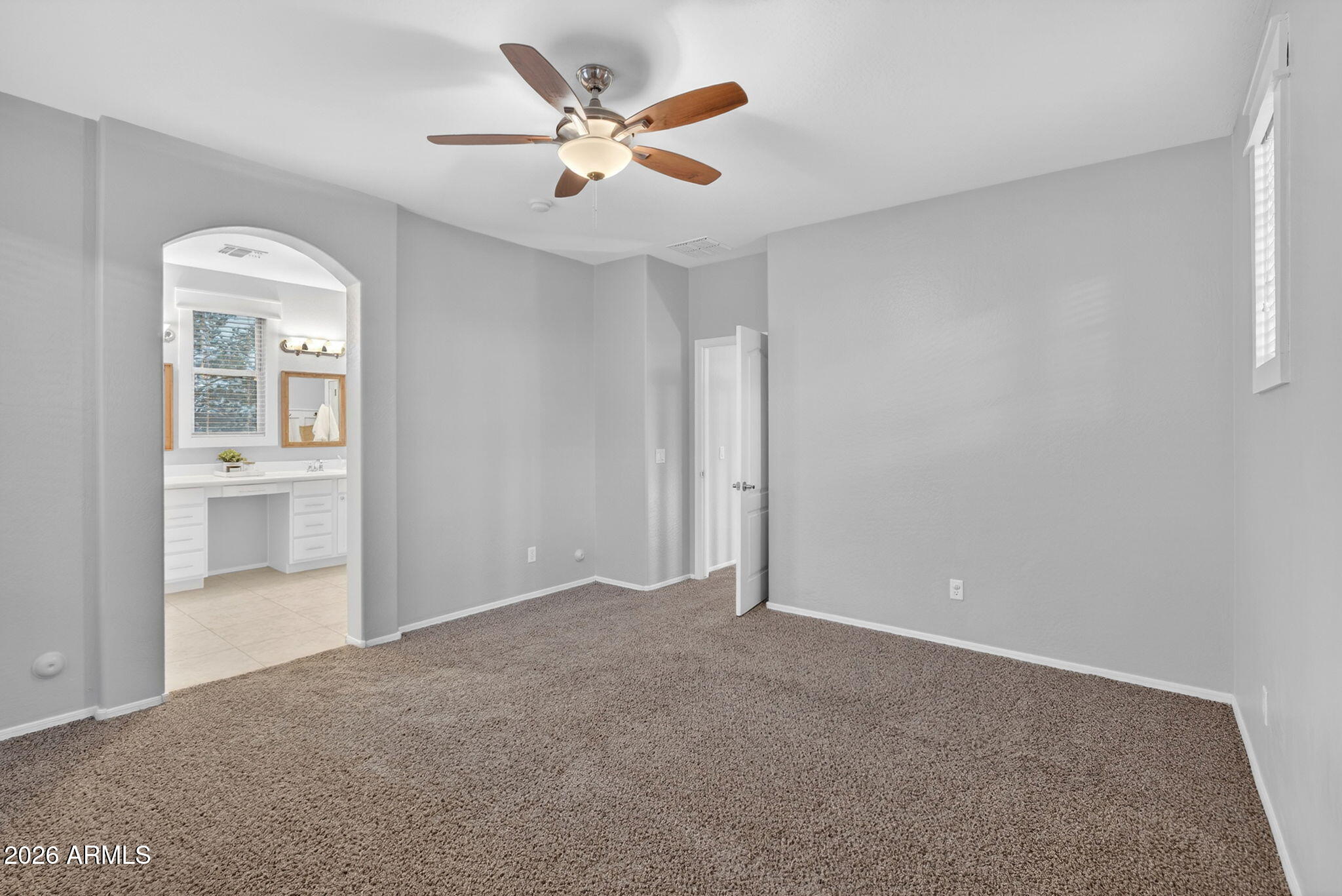 4052 East Milky Way Gilbert, AZ 85295 - Photo 26 of 73 an empty room with closet and a chandelier fan