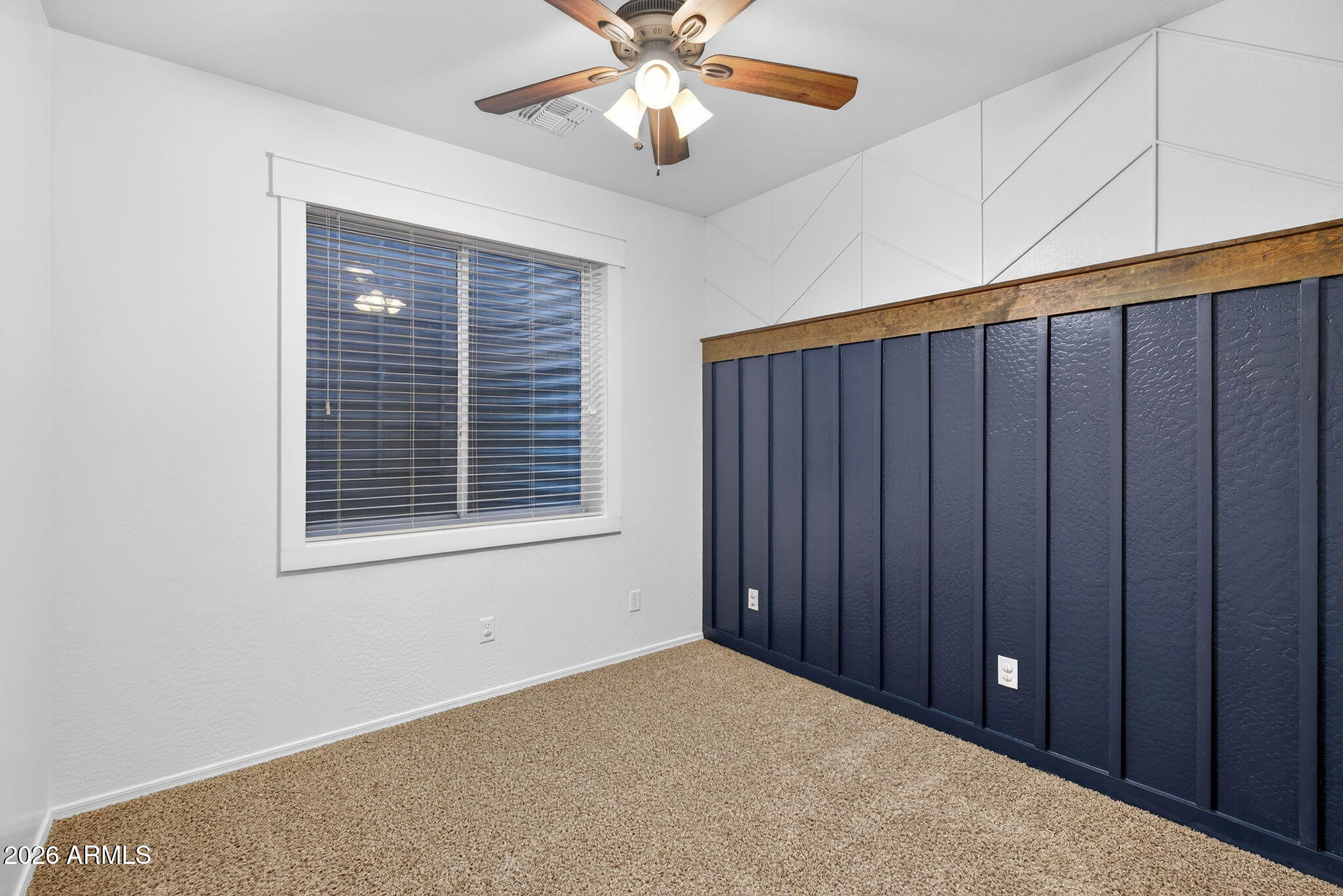 4052 East Milky Way Gilbert, AZ 85295 - Photo 38 of 73 a view of an empty room with window and chandelier fan