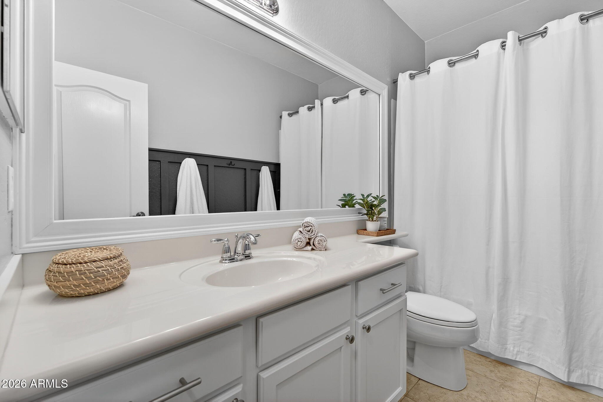 4052 East Milky Way Gilbert, AZ 85295 - Photo 41 of 73 a bathroom with a granite countertop sink a toilet and a mirror