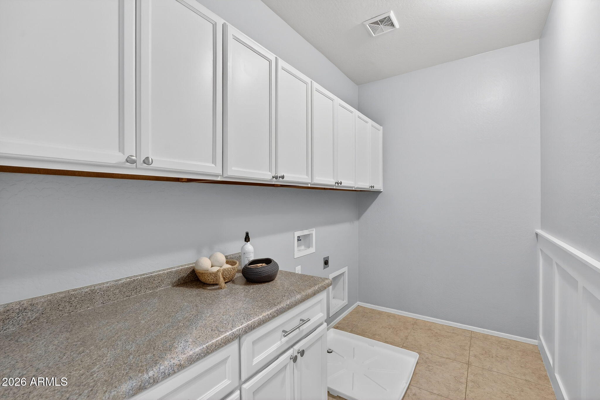 4052 East Milky Way Gilbert, AZ 85295 - Photo 43 of 73 a kitchen with stainless steel appliances granite countertop white cabinets and a hard wood floor