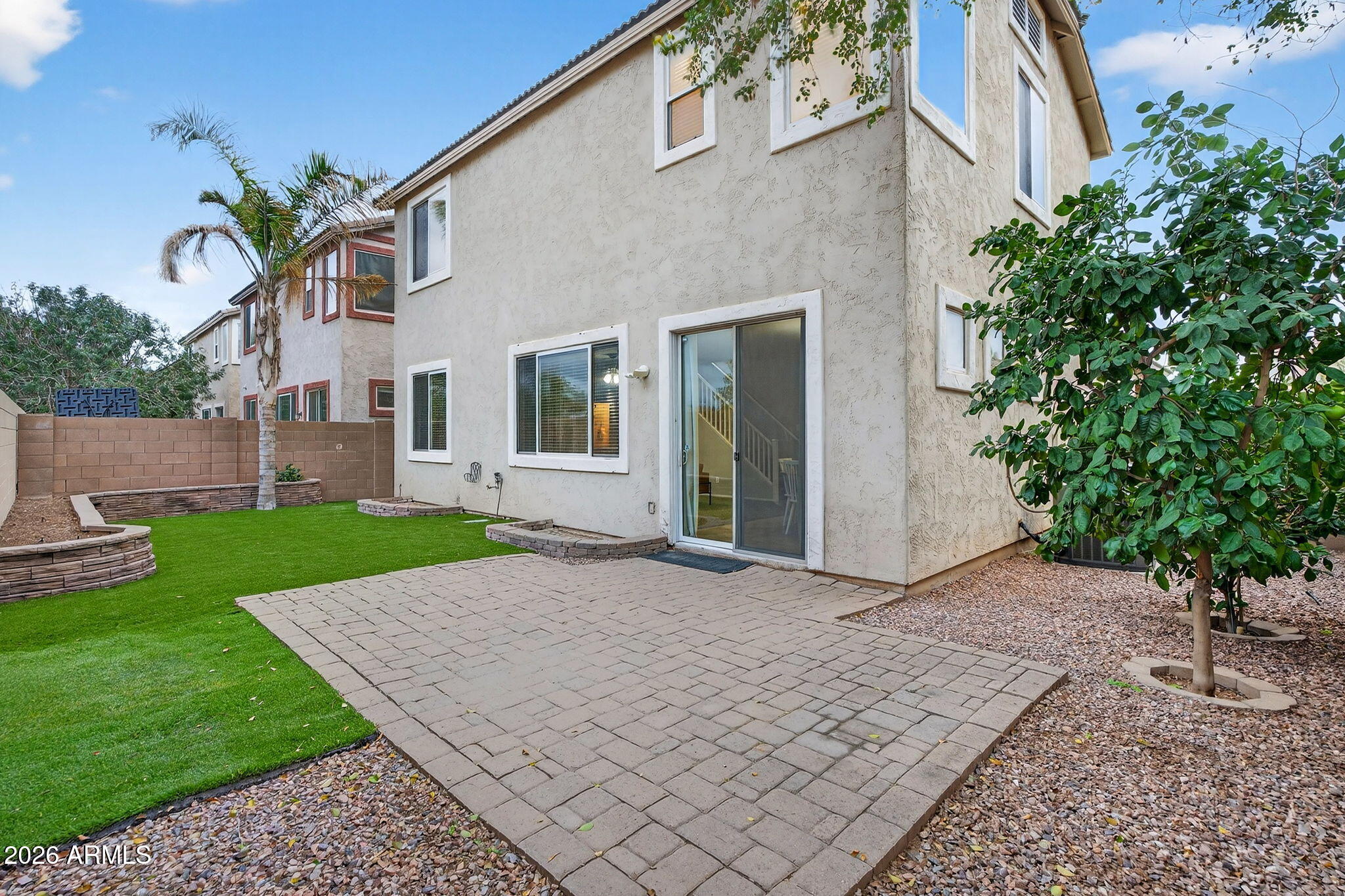 4052 East Milky Way Gilbert, AZ 85295 - Photo 45 of 73 a view of a house with a yard and potted plants