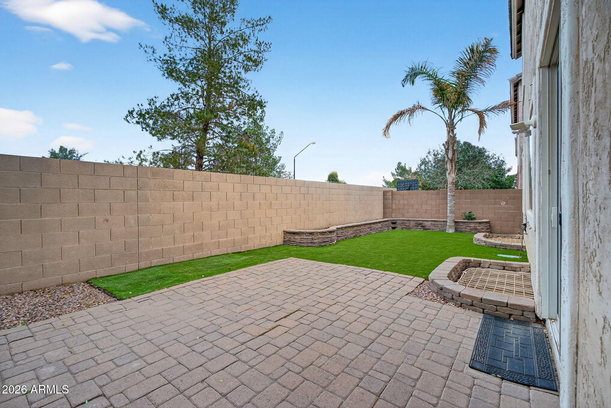 4052 East Milky Way Gilbert, AZ 85295 - Photo 47 of 73 a view of backyard with table and chairs