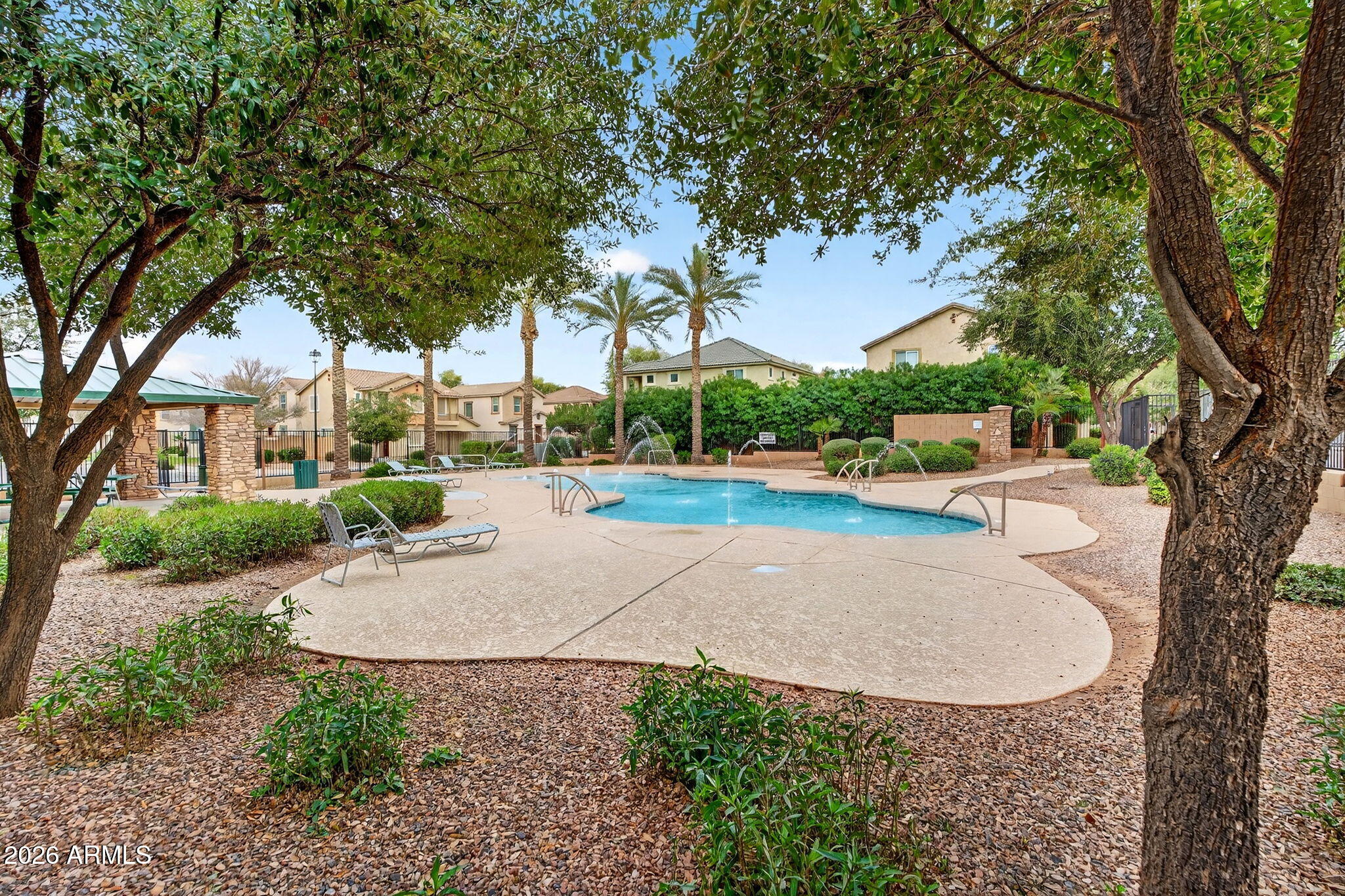 4052 East Milky Way Gilbert, AZ 85295 - Photo 51 of 73 front view of a house with a yard and tree s