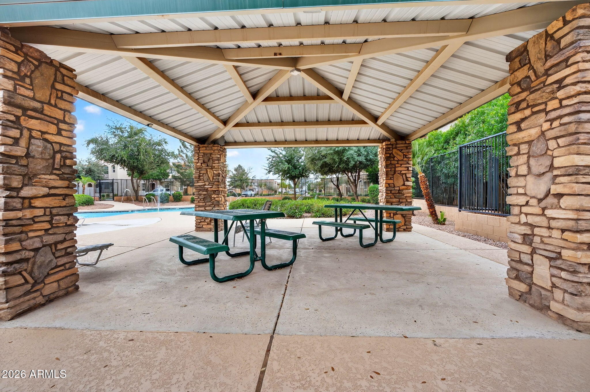 4052 East Milky Way Gilbert, AZ 85295 - Photo 52 of 73 a view of patio with a table and chairs under an umbrella with a barbeque