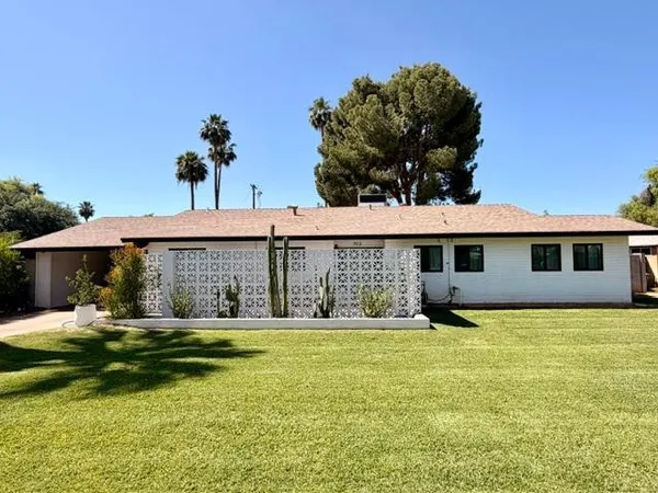 a front view of house with yard and seating area