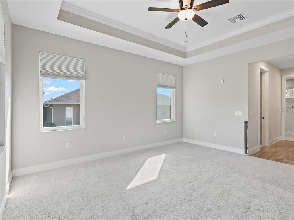 562 Dowling Circle Lady Lake, FL 32159 - Photo 28 of 62 an empty room with fan and windows