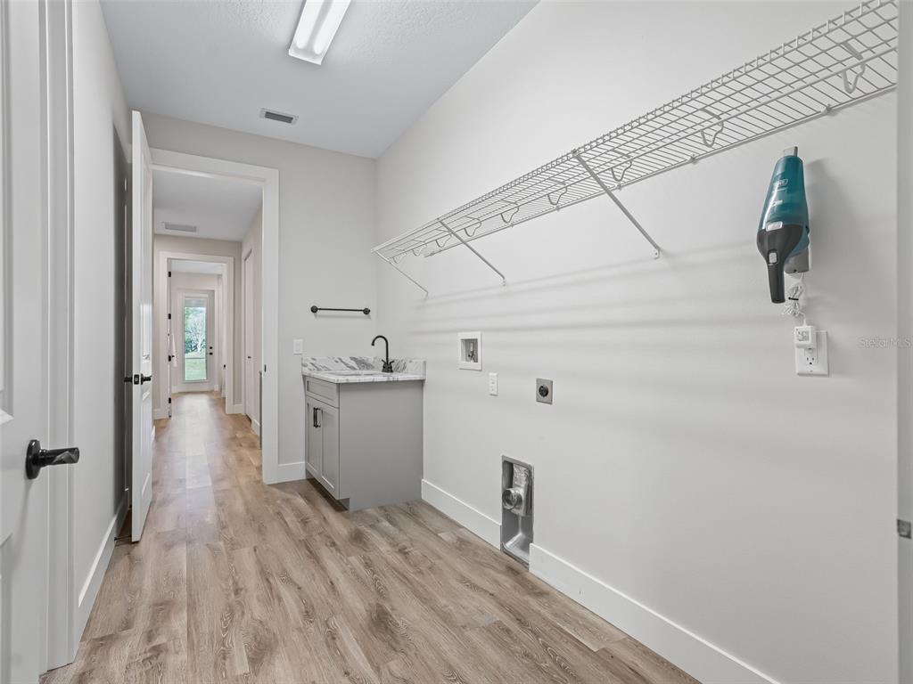 562 Dowling Circle Lady Lake, FL 32159 - Photo 42 of 62 a view of hallway with wooden floor