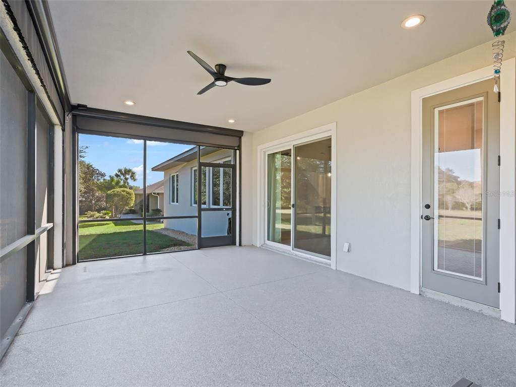 562 Dowling Circle Lady Lake, FL 32159 - Photo 46 of 62 a view of a porch with furniture and floor to ceiling window