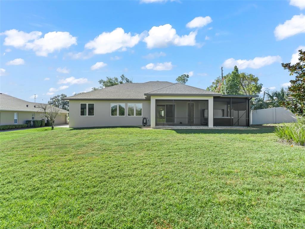 562 Dowling Circle Lady Lake, FL 32159 - Photo 53 of 62 a front view of a house with a garden