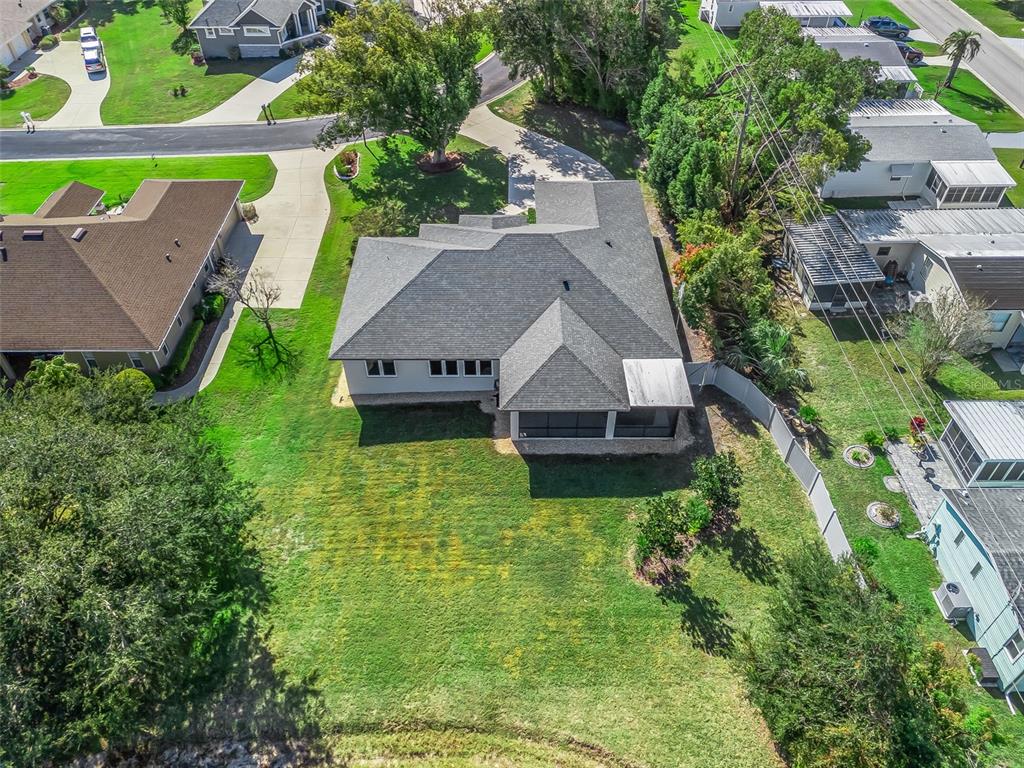 562 Dowling Circle Lady Lake, FL 32159 - Photo 54 of 62 an aerial view of a house with a garden