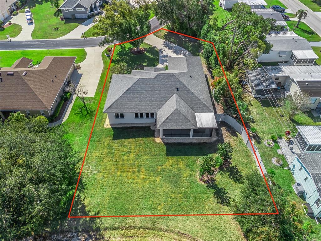 562 Dowling Circle Lady Lake, FL 32159 - Photo 55 of 62 an aerial view of a house with a garden