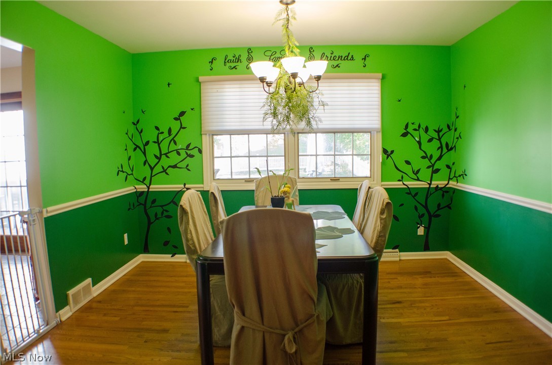 369 Sand Run Road Akron, OH 44313 - Photo 5 of 35 Formal Dining Room with chair rail and hardwood floors.