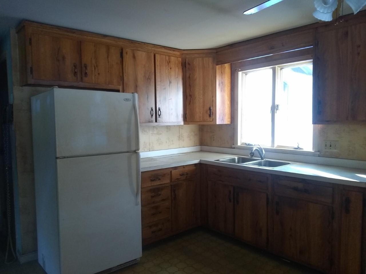220 East Jay Road Jay, ME 04239 - Photo 7 of 21 0328 refirg cabinets and window over sin