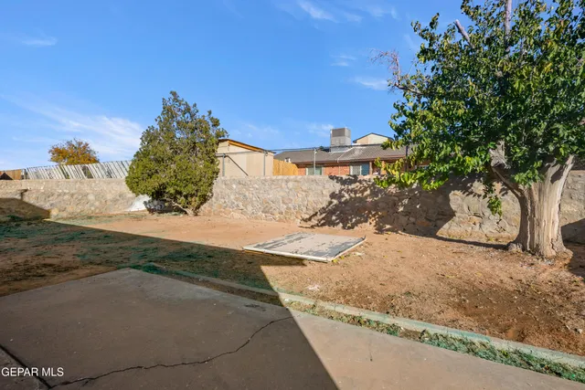 a view of a backyard of a house