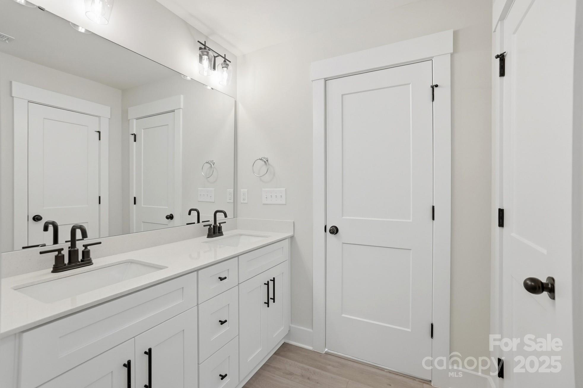 111 Viburnum Road Waxhaw, NC 28173 - Photo 26 of 39 a bathroom with a double vanity sink and mirror