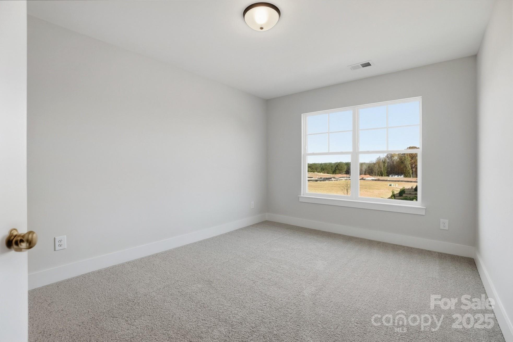111 Viburnum Road Waxhaw, NC 28173 - Photo 30 of 39 an empty room with a window
