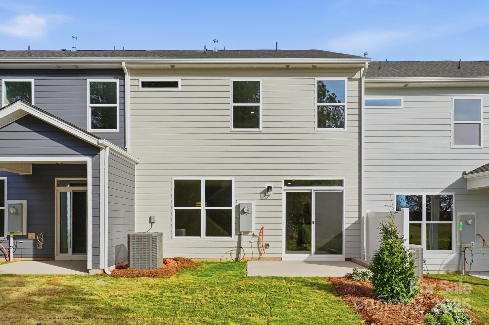 111 Viburnum Road Waxhaw, NC 28173 - Photo 38 of 39 a view of a house with large windows and plants