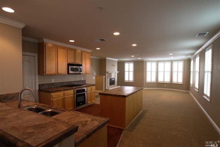 9137 Windsor Road Windsor, CA 95492 - Photo 1 of 1 a kitchen with stainless steel appliances granite countertop a sink stove and cabinets