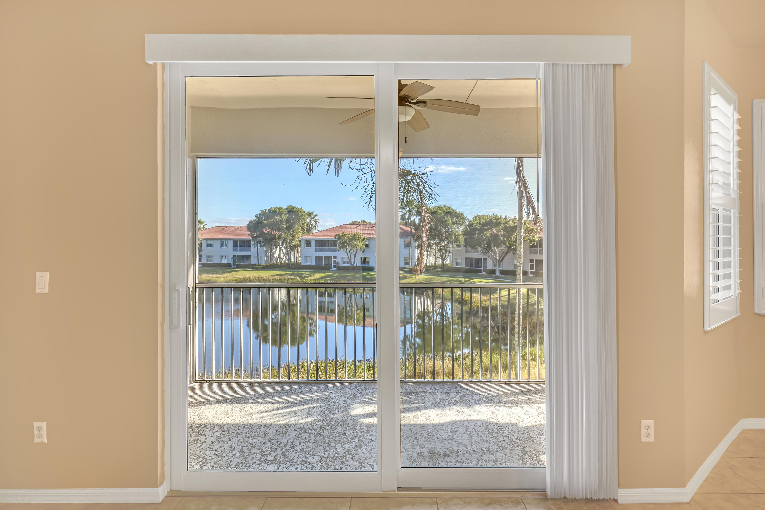 2136 Wingate Bend Wellington, FL 33414 - Photo 16 of 44 a view of a glass door with a glass door