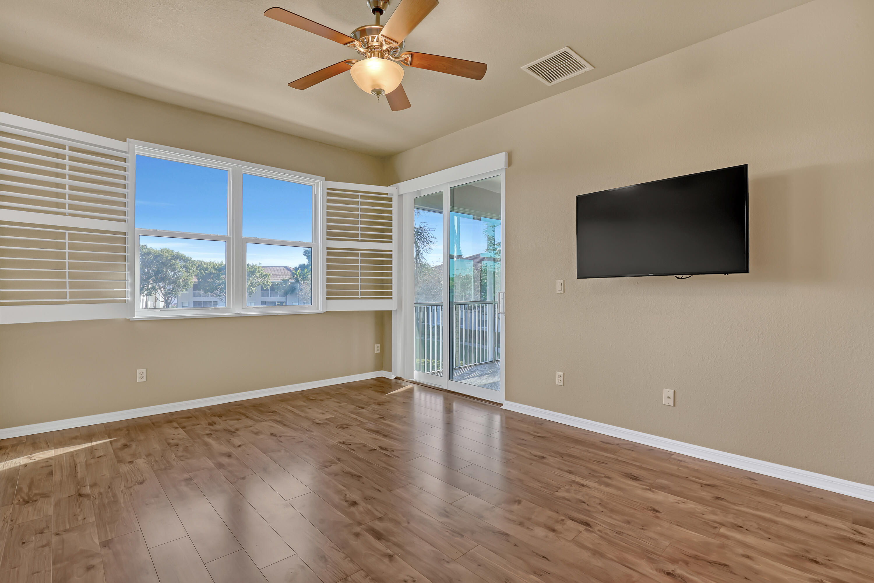 2136 Wingate Bend Wellington, FL 33414 - Photo 18 of 44 wooden floor in an empty room with a window