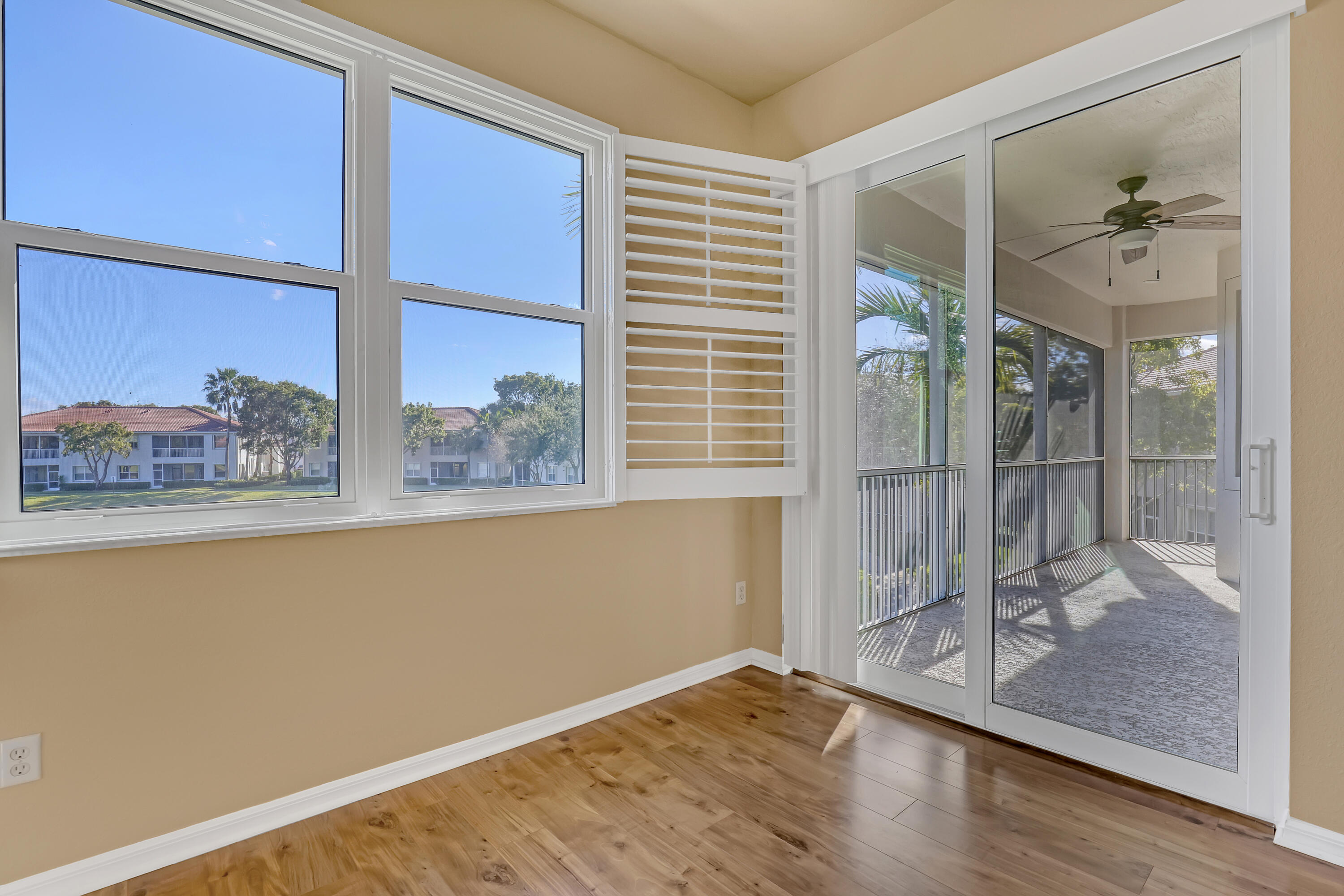 2136 Wingate Bend Wellington, FL 33414 - Photo 19 of 44 a view of a room with wooden floor and a window
