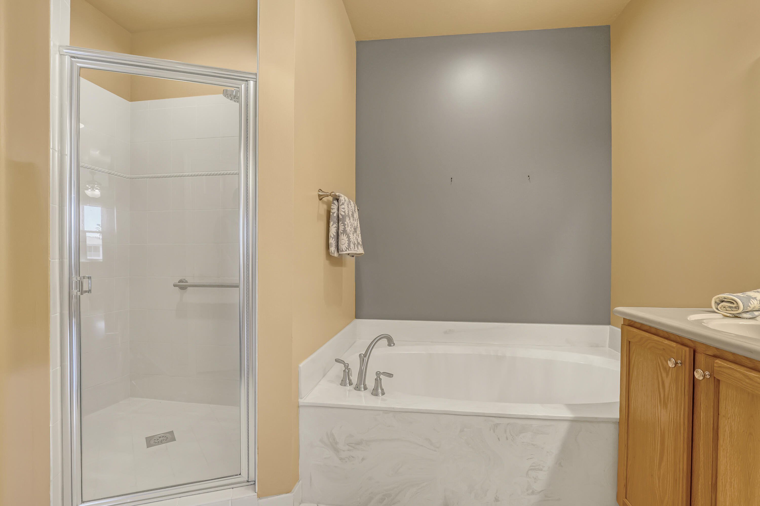 2136 Wingate Bend Wellington, FL 33414 - Photo 23 of 44 a bathroom with a bathtub