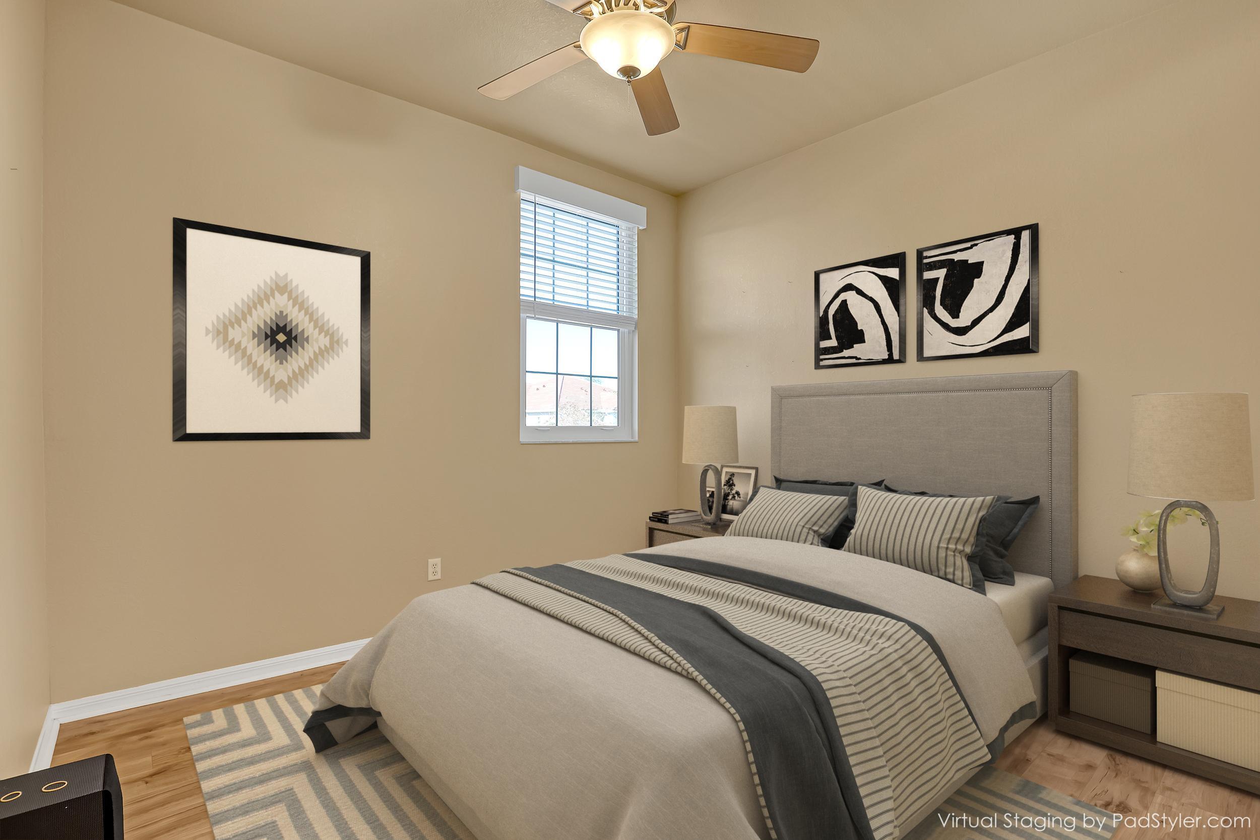 2136 Wingate Bend Wellington, FL 33414 - Photo 25 of 44 a bedroom with a bed and a chandelier