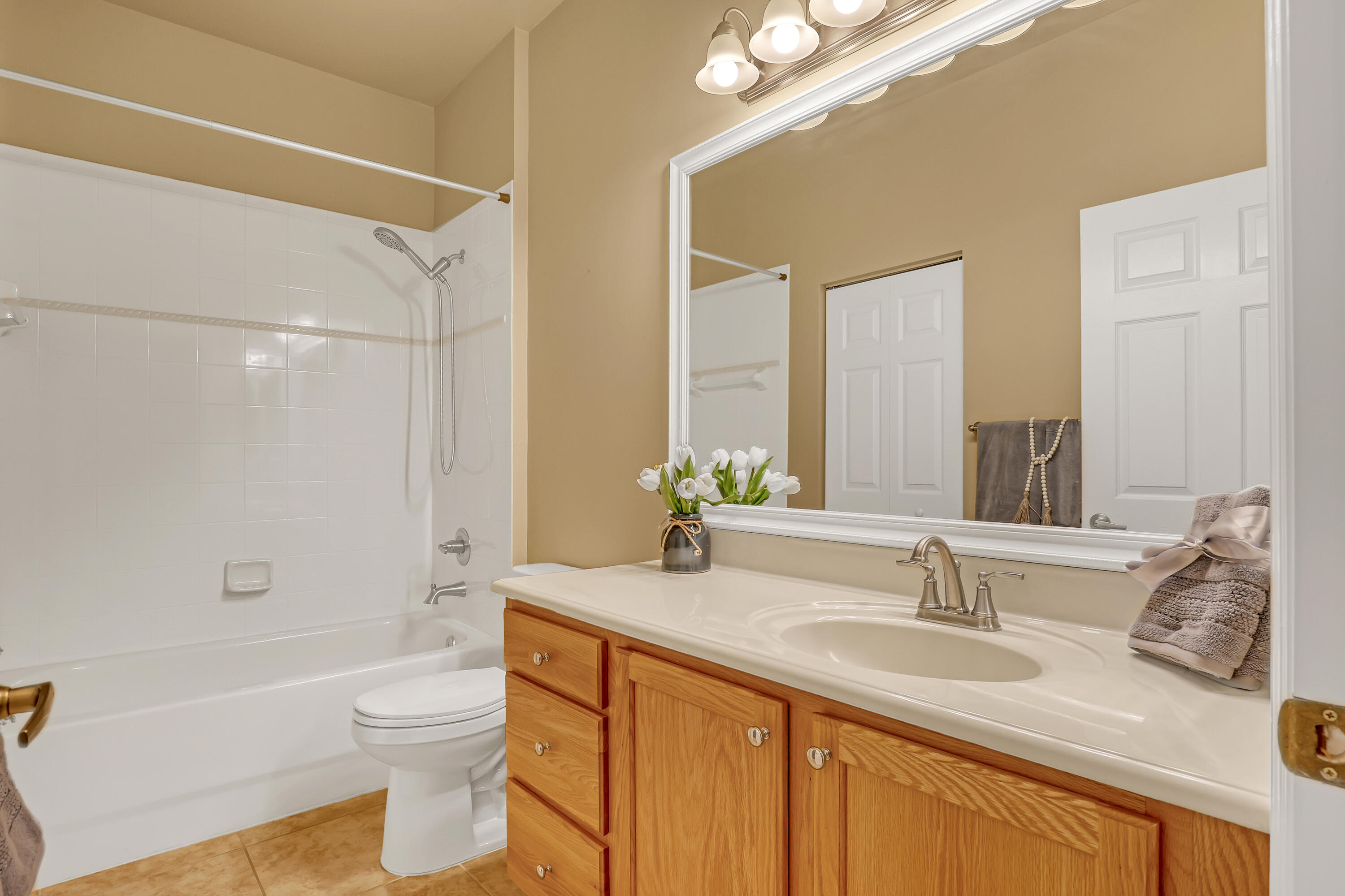 2136 Wingate Bend Wellington, FL 33414 - Photo 27 of 44 a bathroom with a granite countertop sink toilet and shower