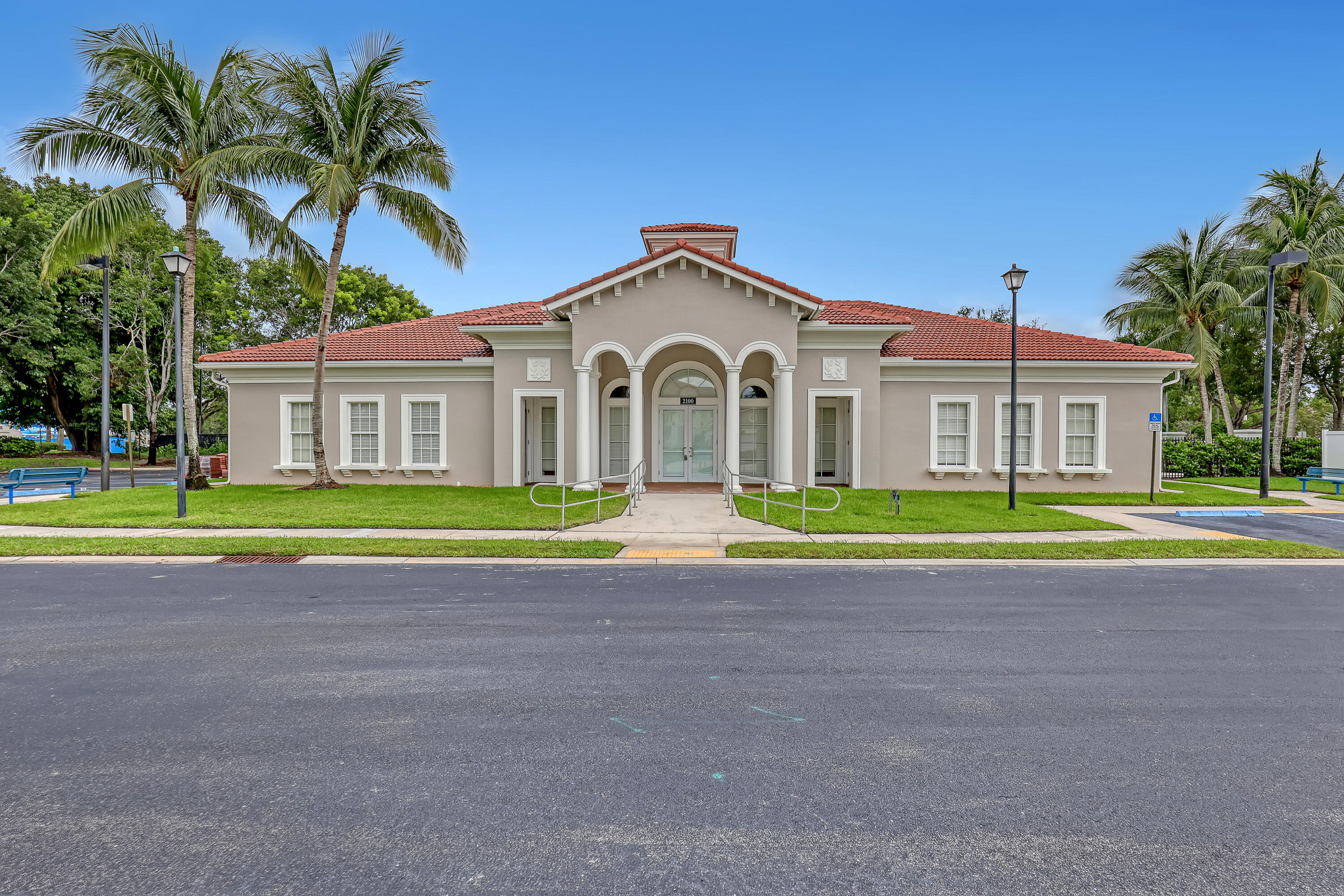 2136 Wingate Bend Wellington, FL 33414 - Photo 34 of 44 a view of a house with a swimming pool and a yard