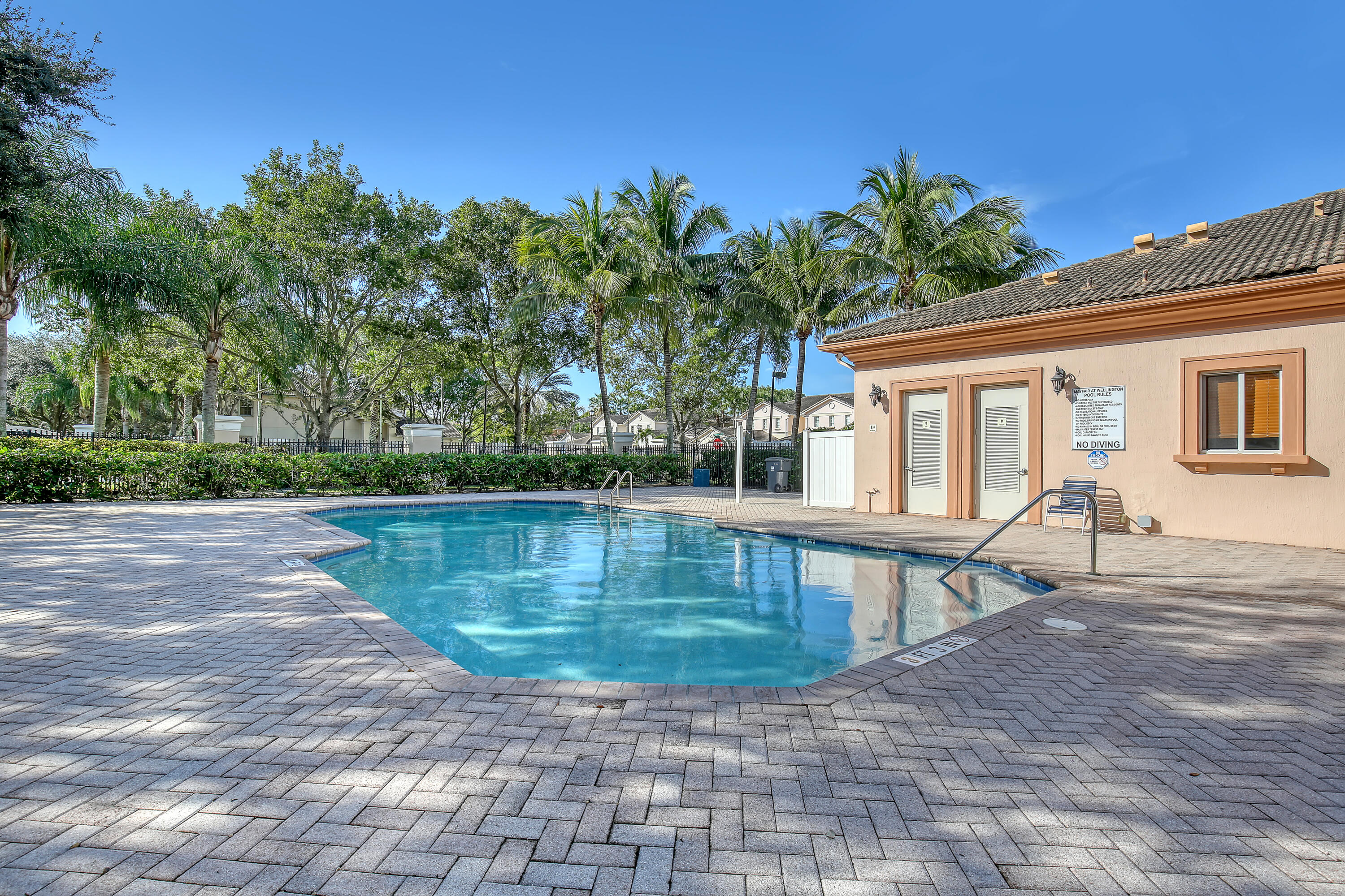 2136 Wingate Bend Wellington, FL 33414 - Photo 35 of 44 a view of a swimming pool with a patio