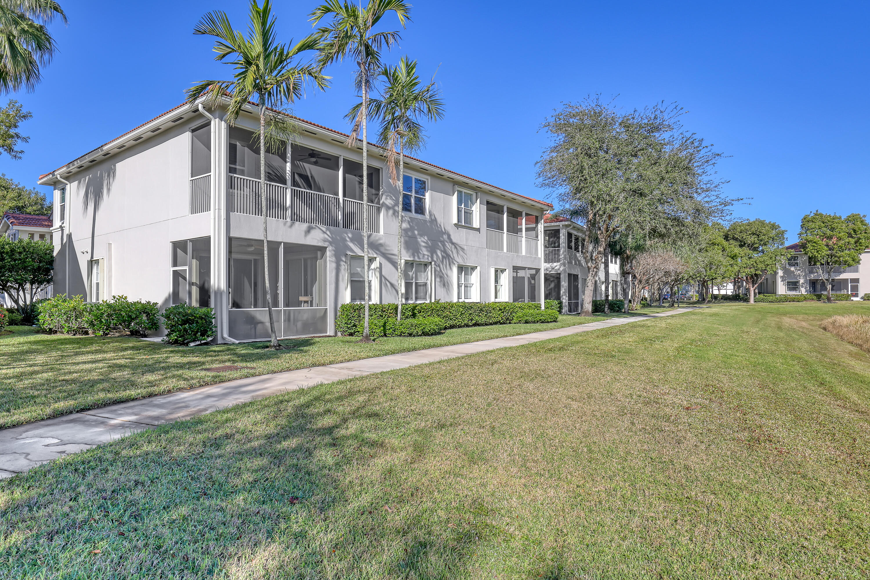 2136 Wingate Bend Wellington, FL 33414 - Photo 41 of 44 a view of a house with a yard