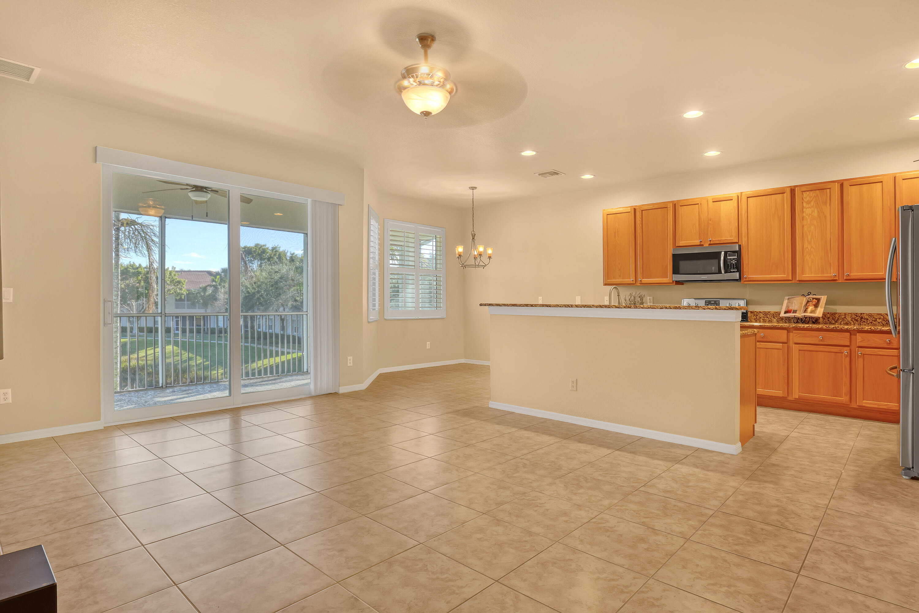 2136 Wingate Bend Wellington, FL 33414 - Photo 5 of 44 a view of a kitchen with a sink and cabinets