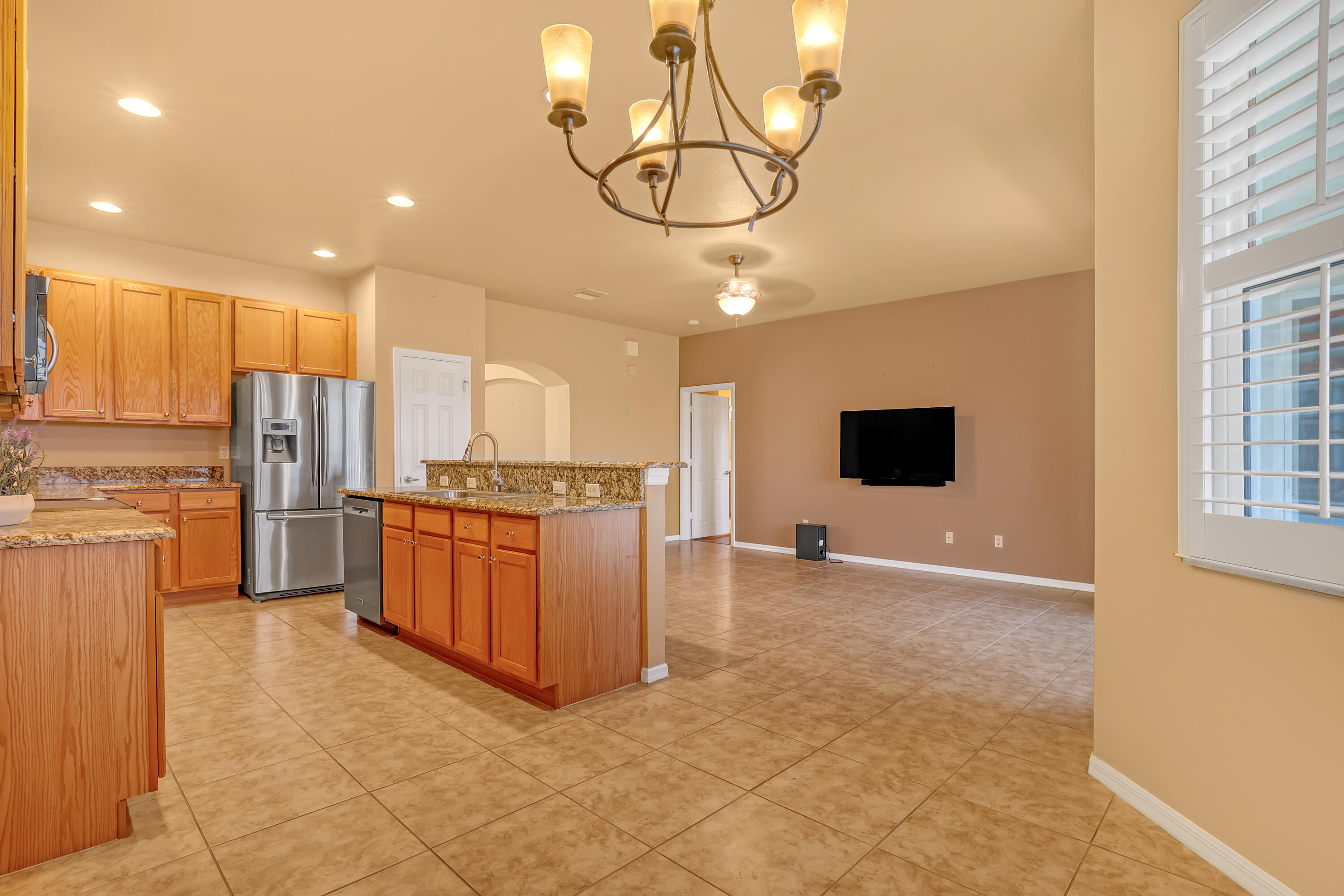 2136 Wingate Bend Wellington, FL 33414 - Photo 6 of 44 a kitchen with stainless steel appliances granite countertop a refrigerator a stove a sink and a microwave