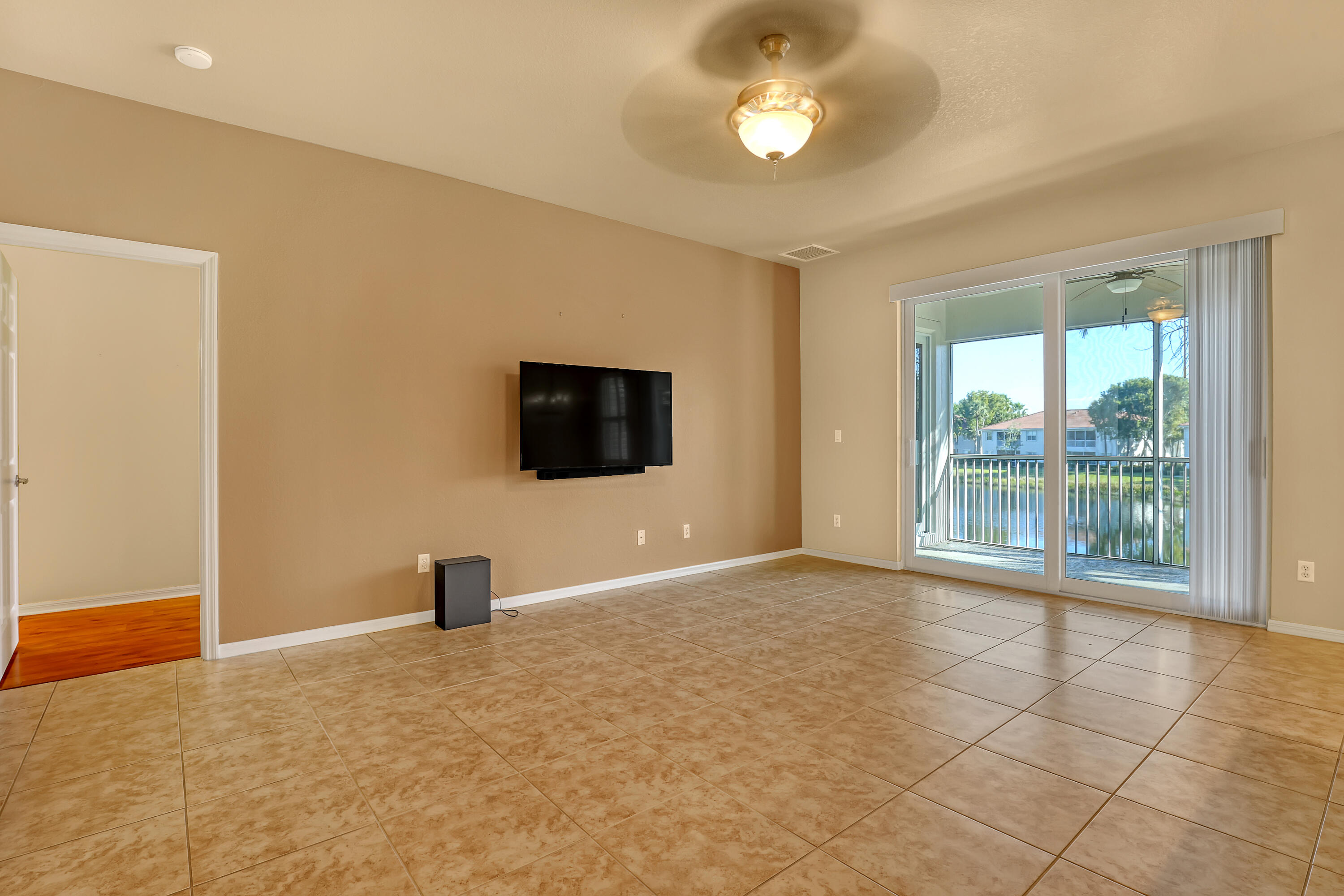 2136 Wingate Bend Wellington, FL 33414 - Photo 10 of 44 a view of an empty room with a window