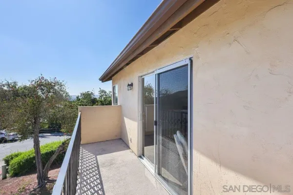 a view of a back yard from a balcony