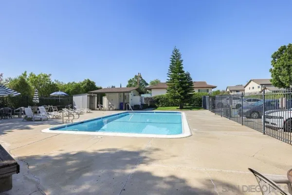 a view of a swimming pool with a patio