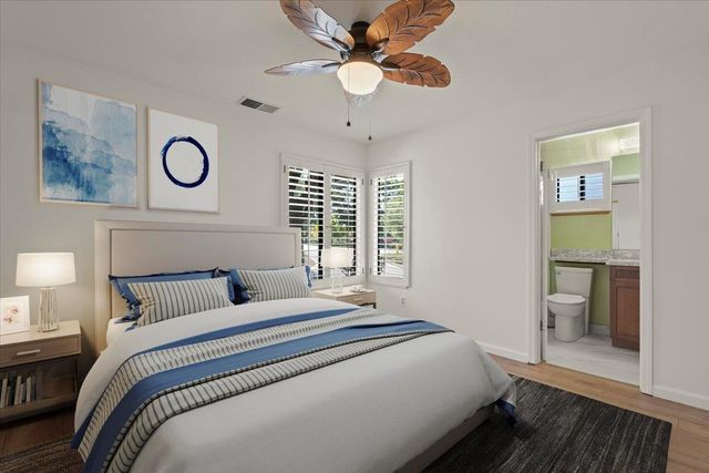 a bedroom with bed and a window