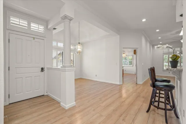 wooden floor in an empty room with a window