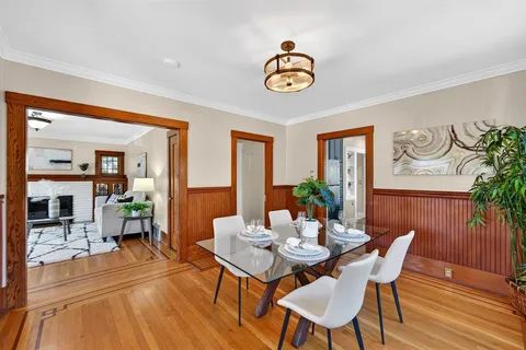 a large kitchen with kitchen island a large counter top space a sink stainless steel appliances and windows