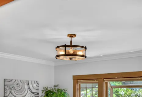 a kitchen with wooden cabinets and stainless steel appliances