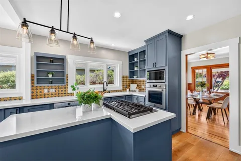 a bedroom with a bed and glass window