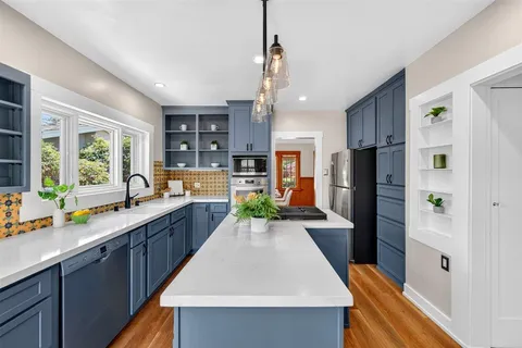 a bedroom with a large bed and a window