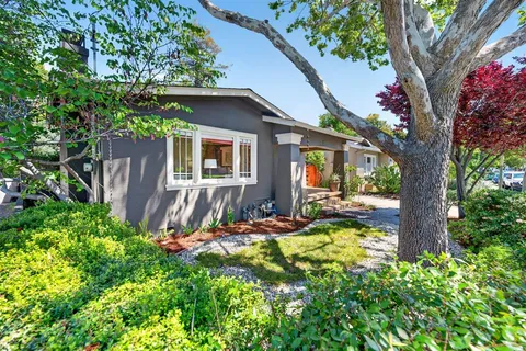a view of a backyard of the house