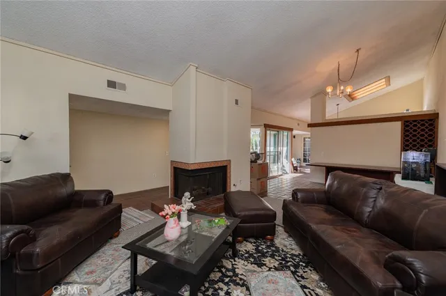 a living room with furniture a lamp and a fireplace