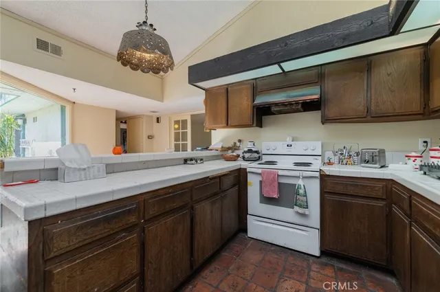 a kitchen with stainless steel appliances granite countertop a sink and cabinets
