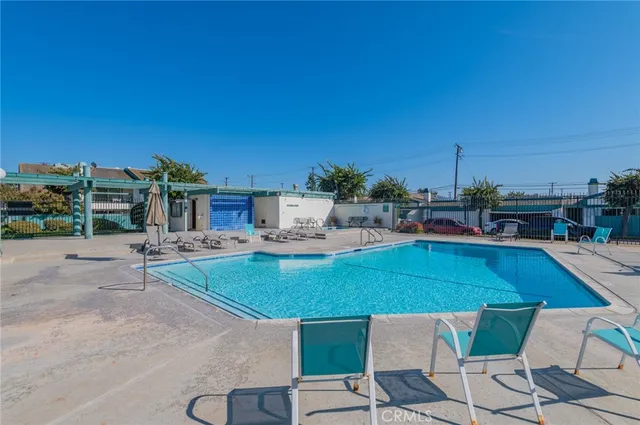 a view of a swimming pool with a patio
