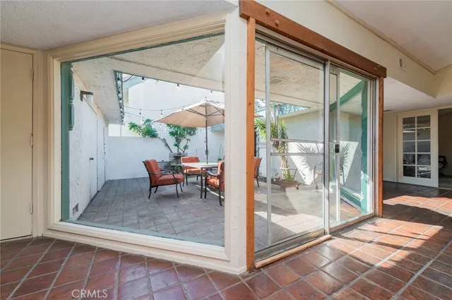 a dining room with a glass door and glass door